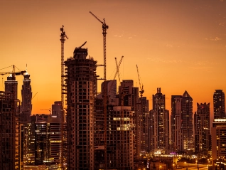 City construction site at sunset
