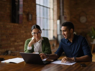 man and woman discussing credit risk