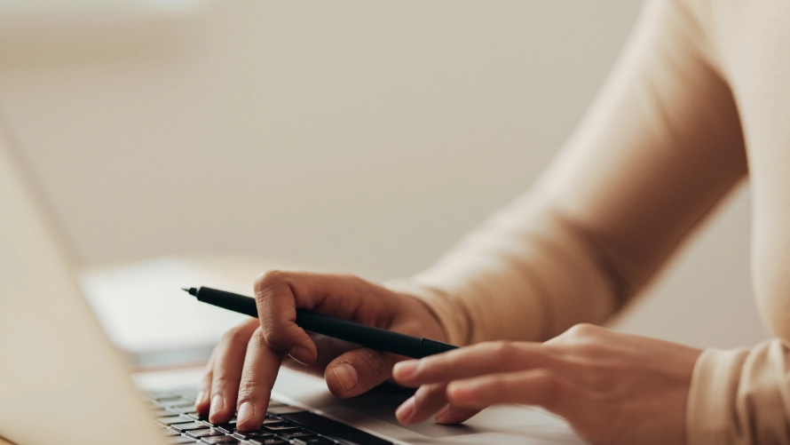 Close-up of Asian woman working on a laptop