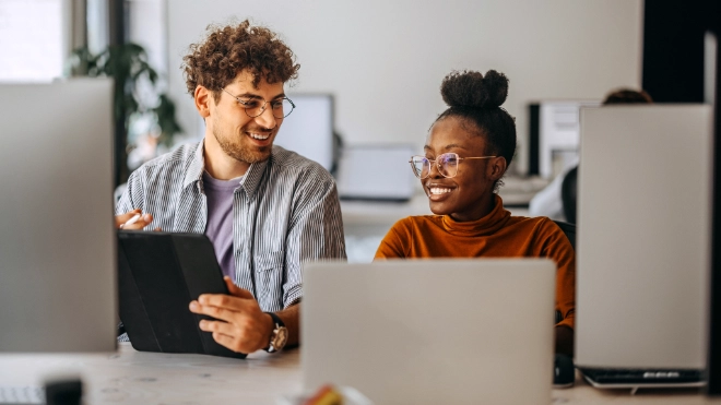 woman and man behind computers