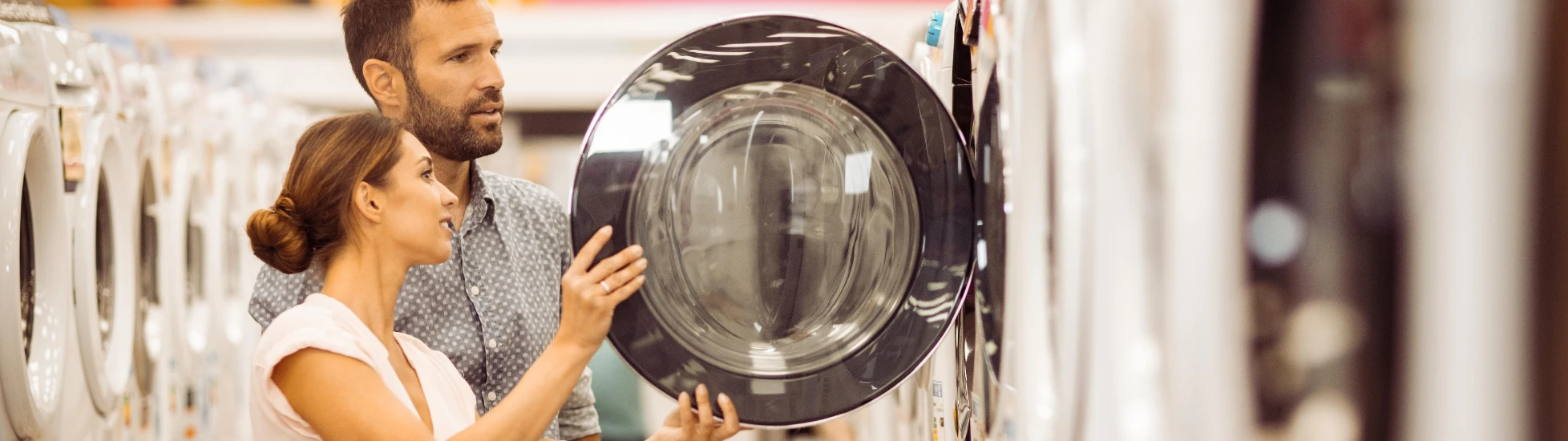 couple buying washing machines